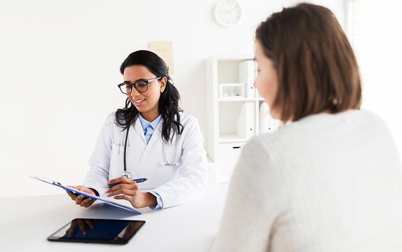 doctor reviewing chart with patient